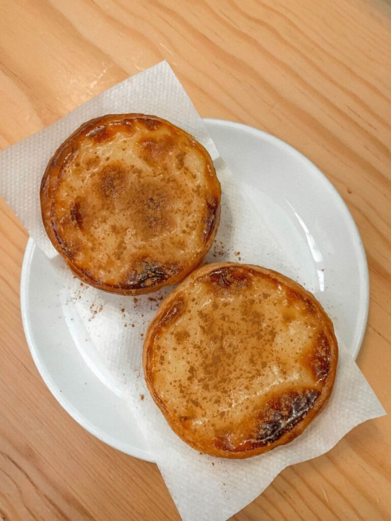 Two pastéis de nata from Manteigaria in Lisbon.
