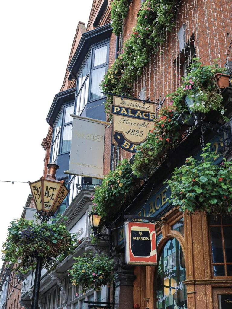 A street in Dublin with pub signs on the walls.