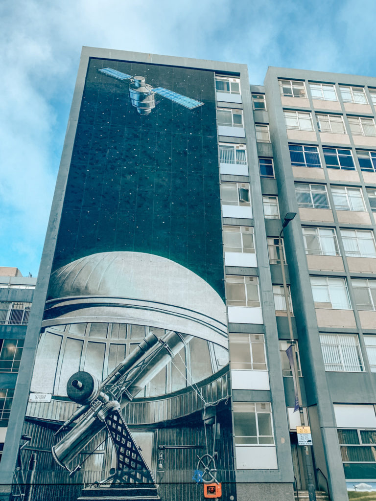 A mural, part of the Strathclyde Wonderwall, which features a telescope