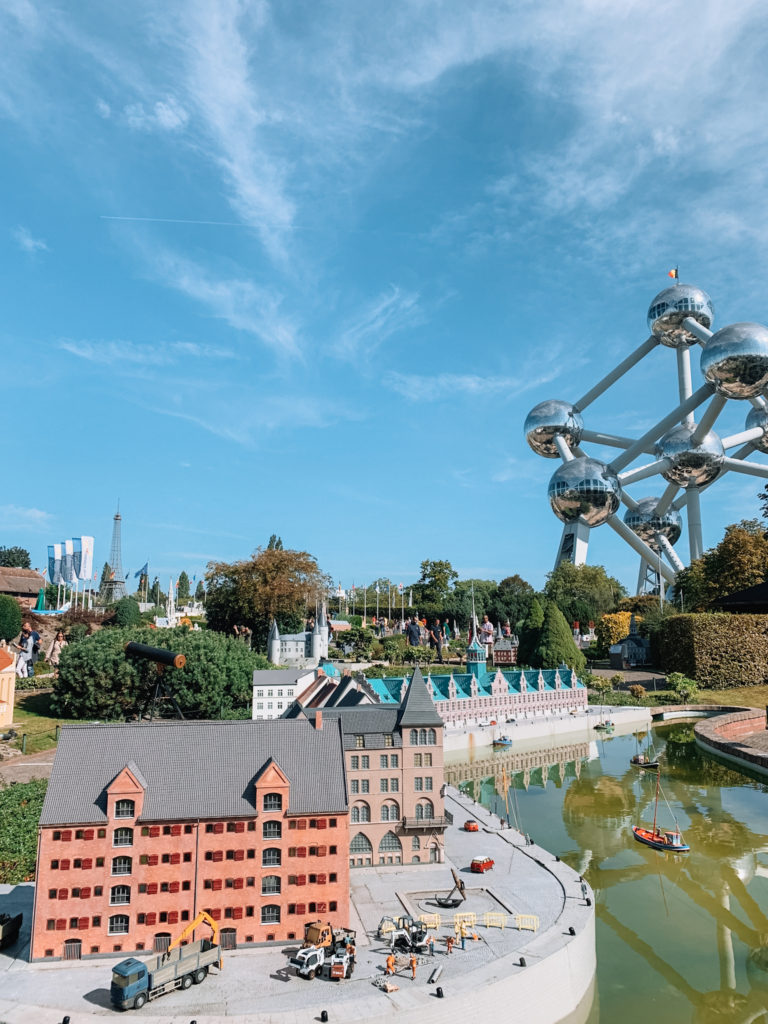 small sculptures in mini Europe with the Atomium in the background