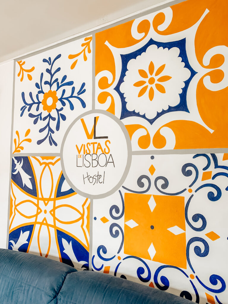 a sign advertising the Vistas Lisboa Hostel in Lisbon, Portugal
