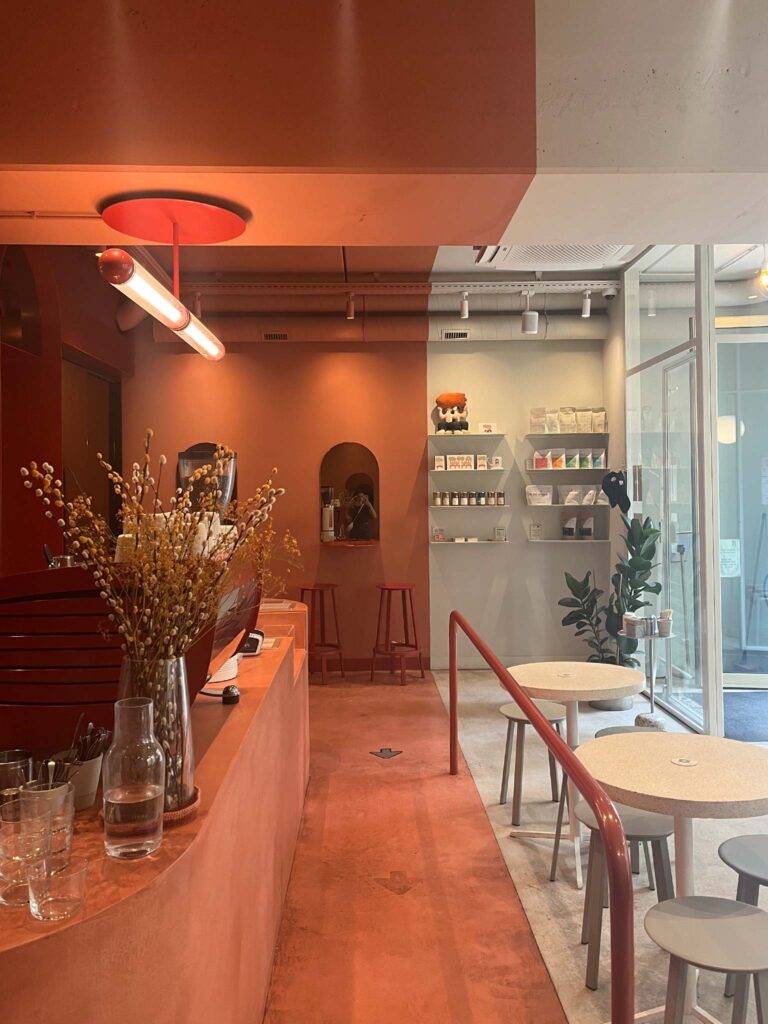 pink and white interior of Buddy buddy cafe in Brussels