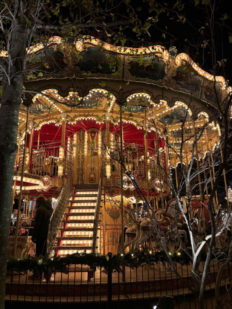 Twinkling ornate carousel at Tivoli Gardens in Copenhagen