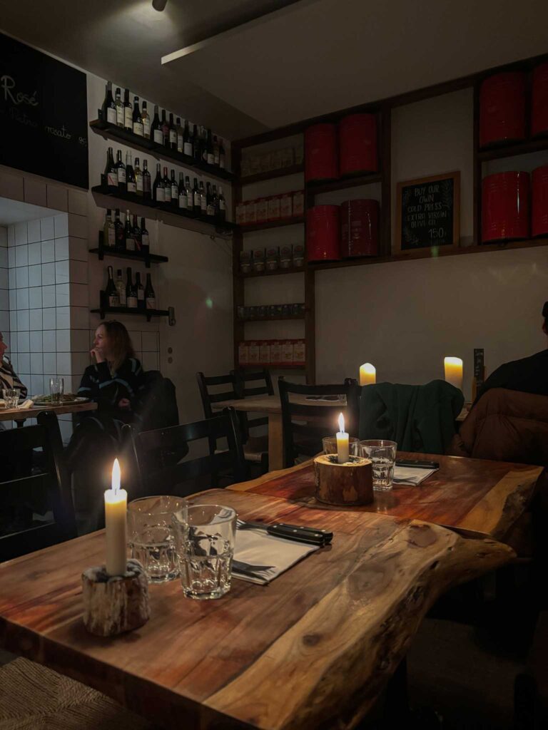 Cosy candlelit interior of Mother, a pizzeria in Copenhagen, Denmark