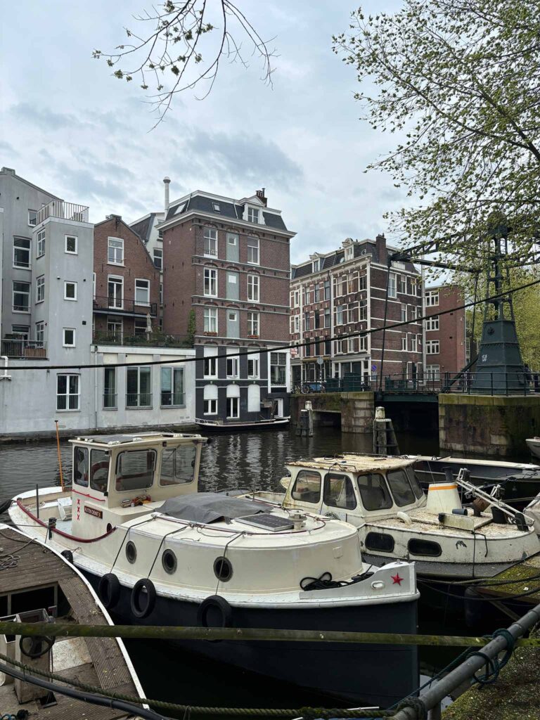 Old boats docked on an Amsterdam canal