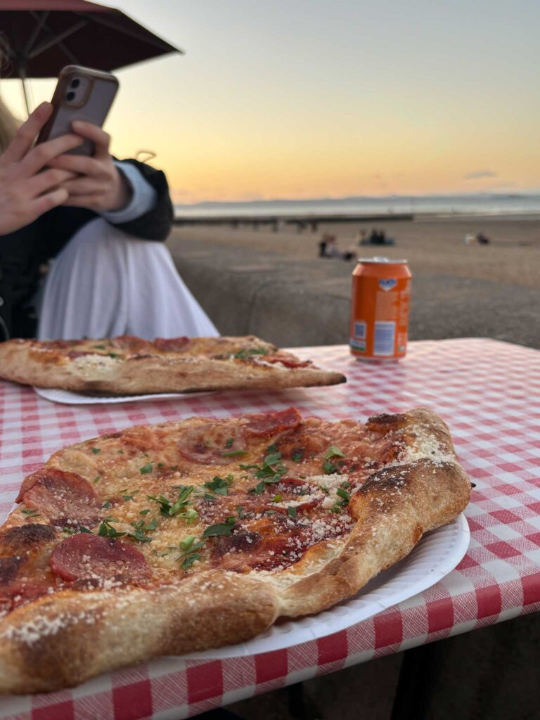 Two slices of pizza from Civerinos, looking out to Portobello beach