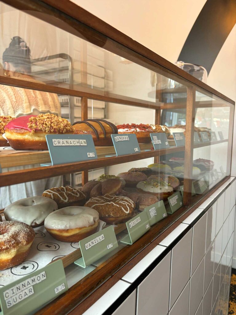 Display cabinet of doughnuts at Kilted Donut in Edinburgh