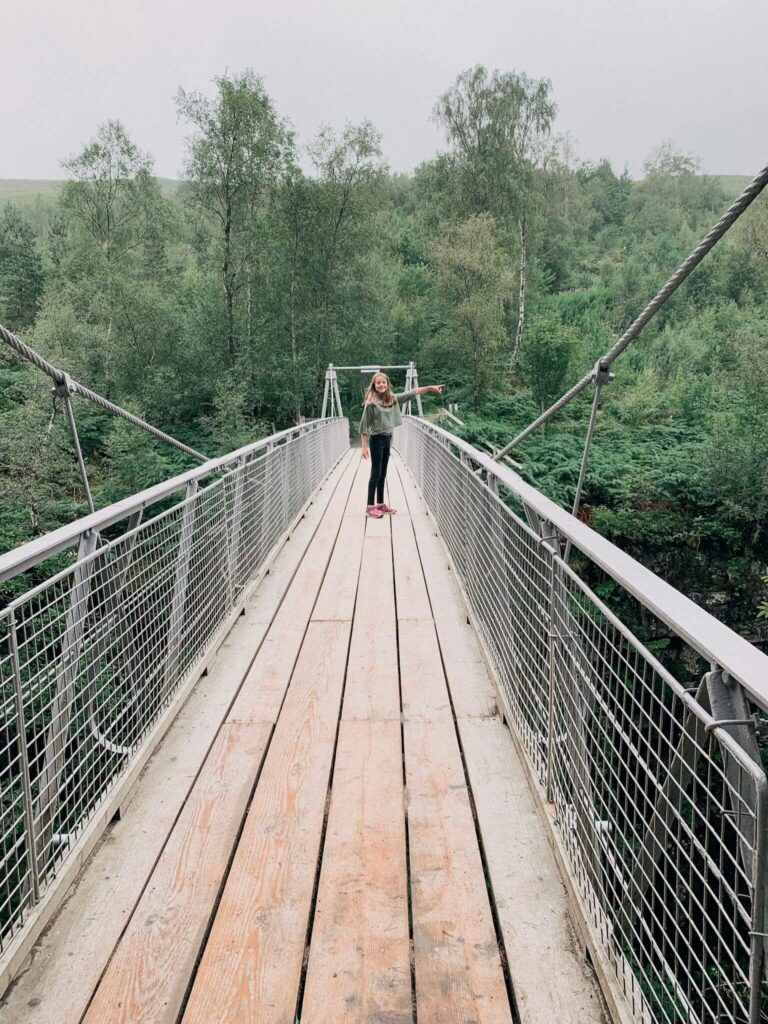 A girl on the suspension bridge over Corrieshalloch Gorge.