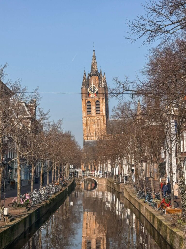 A canal in Delft with Oude Kerk in the distance.