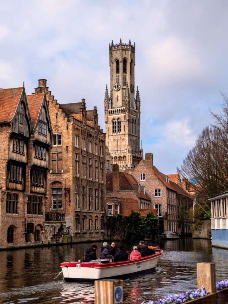 Small boat tour on the Djiver canal at Rozenhoedkaai in Bruges, Belgium