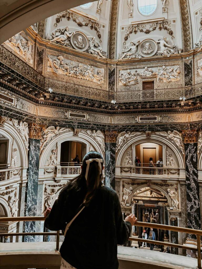 A girl looks over Cupola Hall inside the Kunsthistorisches Museum in Vienna.